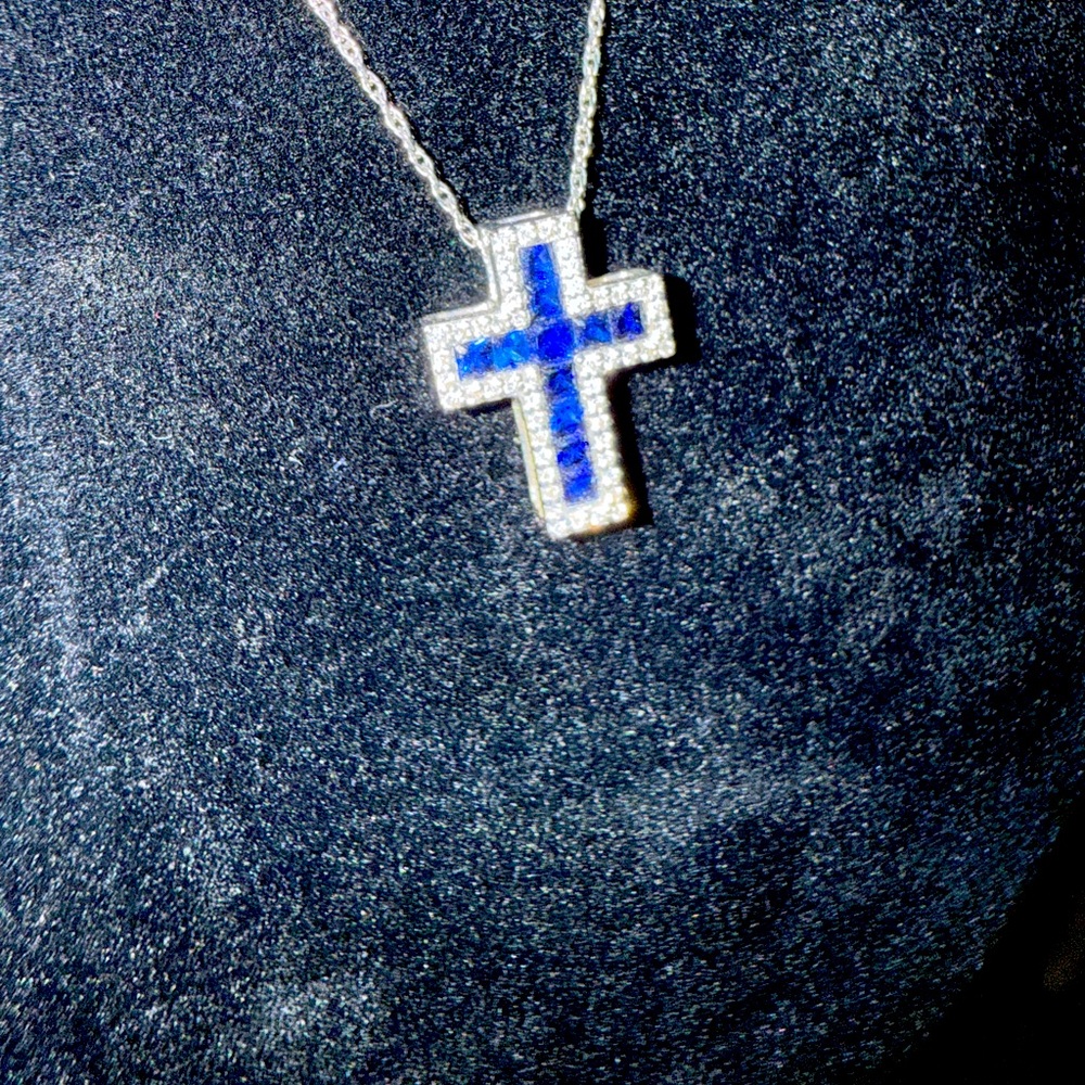 Gorgeous blue sapphire and diamond cross necklace in 10kt white gold